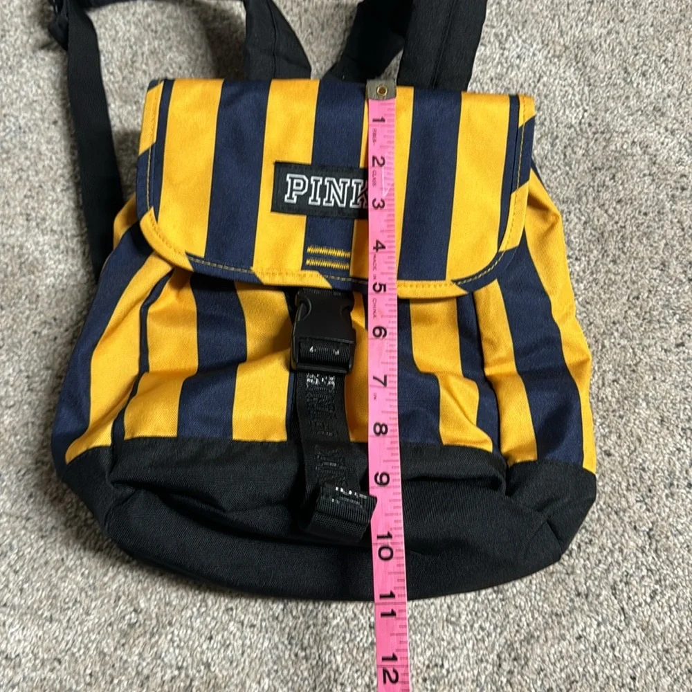 Like New PINK mini backpack navy/yellow stripe drawstring and buckle closure